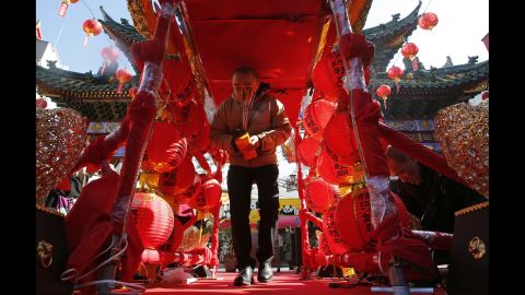 A man walks through red lantern decorations at a temple near Tokyo on February 19.