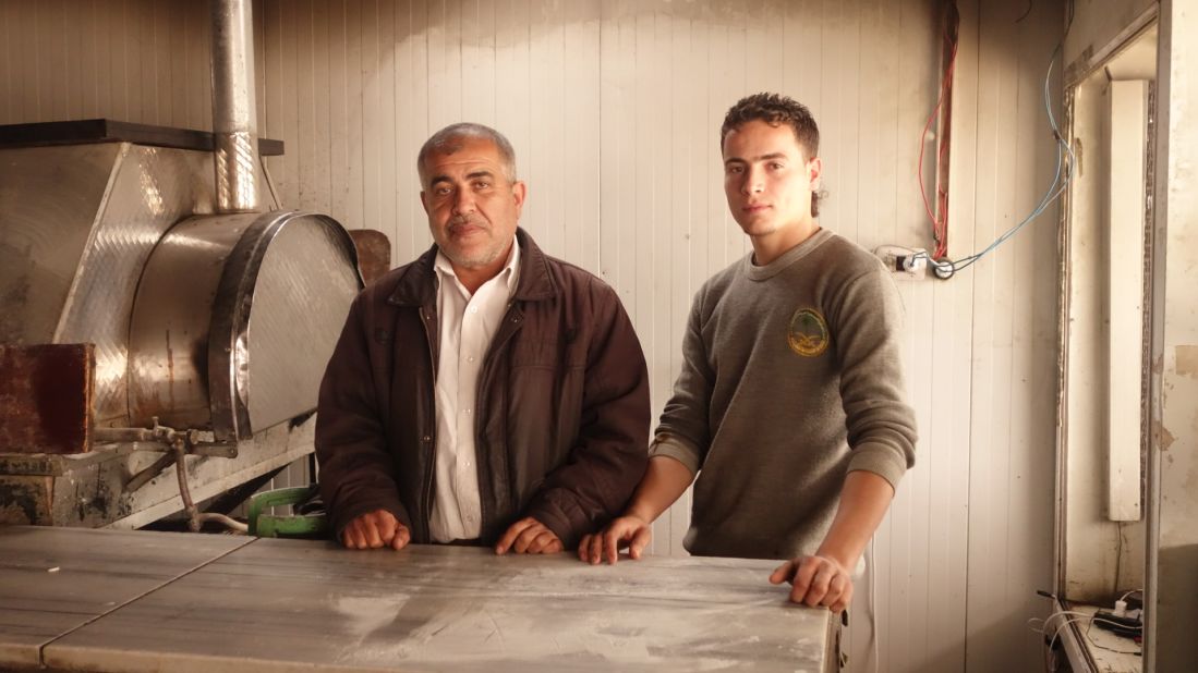 Abu Mohamad, 48, opened his pizza shop with Yehya (right), after meeting him at the Zaatari refugee camp. They're two of many refugees who have become entrepreneurs.