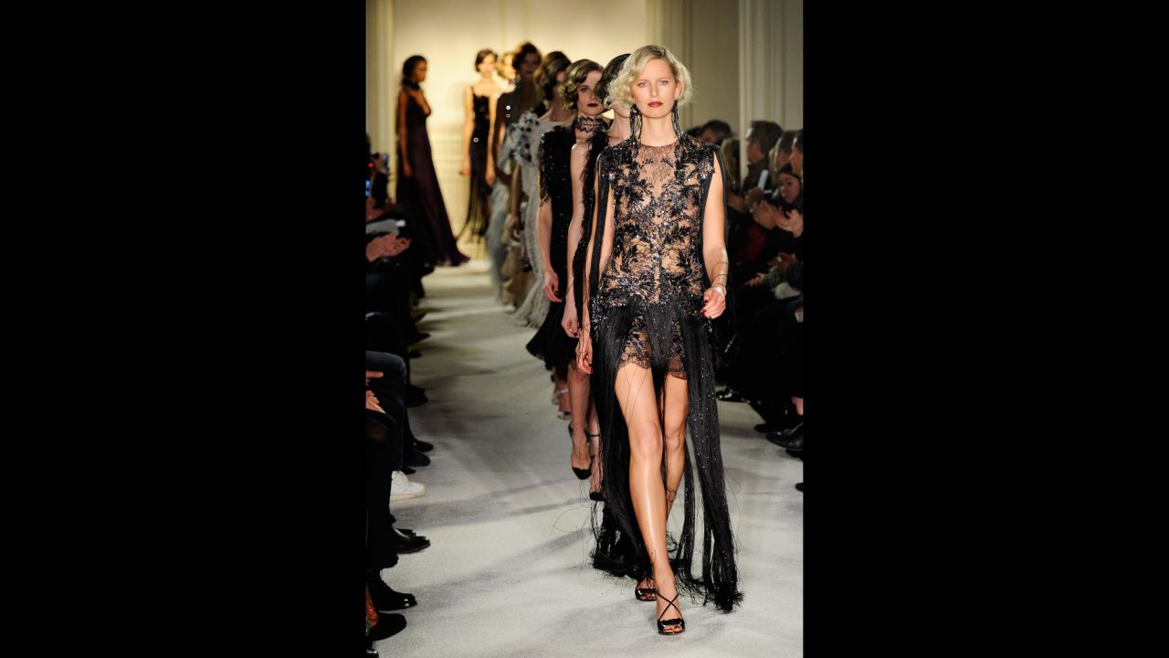 Model Karolina Kurkova, with "Gatsby" hair and a fringe-accented gown, leads the final walk in the Marchesa show.
