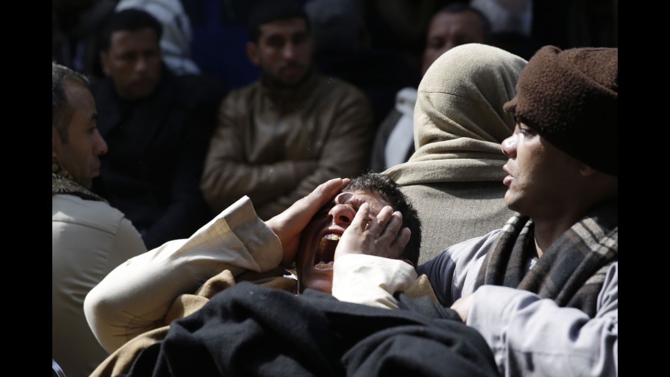 A man in Al Aour, Egypt, mourns Monday, February 16, for the 21 Egyptian Christians who were captured in Libya <a href="http://www.cnn.com/2015/02/18/middleeast/egypt-christians-grieving-village/" target="_blank">and killed by the ISIS militant group.</a> The Egyptian military responded to the killings by bombing ISIS targets in Libya.