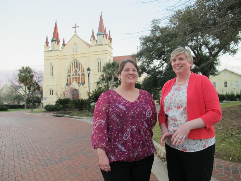 Hours after their February 17 marriage, Meredith Miller, left, and Anna Lisa Carmichael chat in front of Spring Hill College's St. Joseph Chapel, a short walk from the dorm where they met.