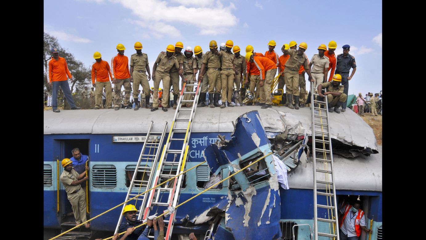 Rescuers clear the debris of a passenger train <a href="http://www.cnn.com/2015/02/13/asia/india-train-accident/index.html" target="_blank">after it derailed</a> on the outskirts of Bengaluru, India, on Friday, February 13. At least 11 passengers were killed and more than 25 were injured, authorities said. 