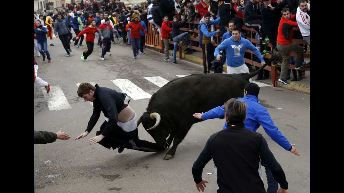 Benjamin Milley, a 20-year-old American, is gored by a bull during a Carnival event in Ciudad Rodrigo, Spain, on Saturday, February 14. He was recovering from his injuries in a Spanish hospital.