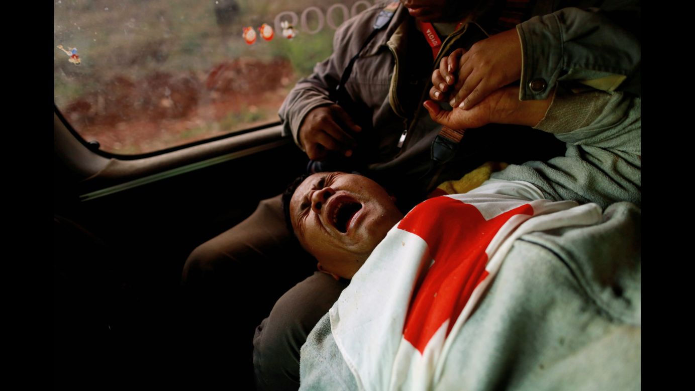 Moe Kyaw Than, a volunteer with the Myanmar Red Cross Society, reacts after being wounded when the convoy he was in was fired upon Tuesday, February 17. Myanmar President Thein Sein <a href="http://www.cnn.com/2015/02/17/asia/myanmar-kokang-state-of-emergency/index.html" target="_blank">declared a state of emergency</a> in the country's Kokang region, where clashes have erupted between rebels and government soldiers.