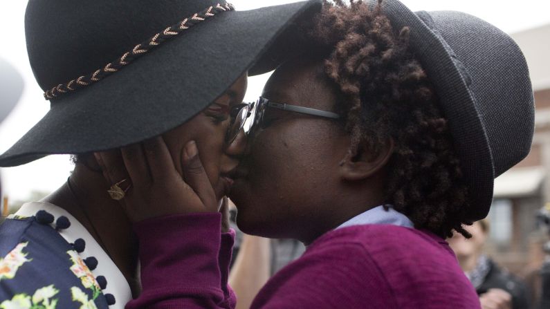 Tori Sisson, left, and Shanté Wolfe kiss after saying their marriage vows in Montgomery, Alabama, on Monday, February 9.