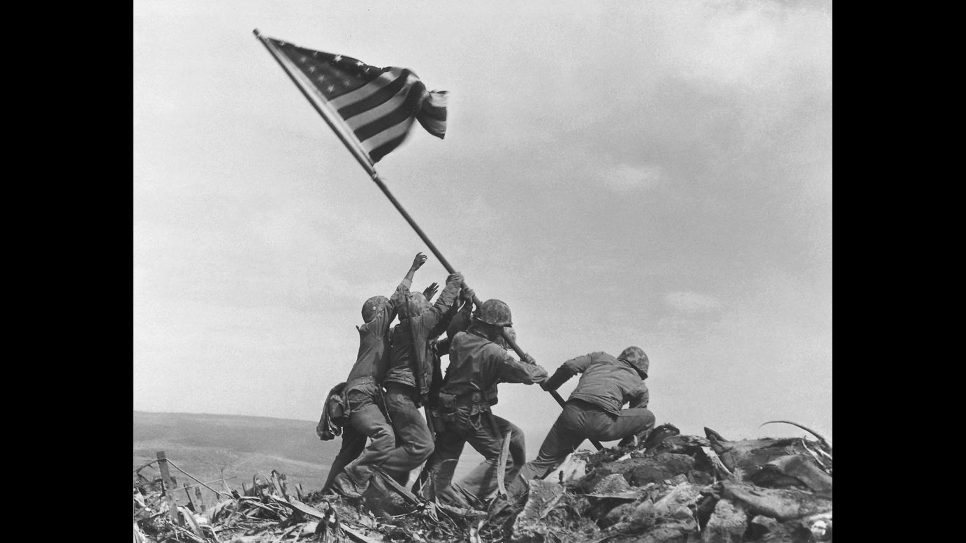 US Marines raise the American flag atop Mount Suribachi on February 23, 1945.