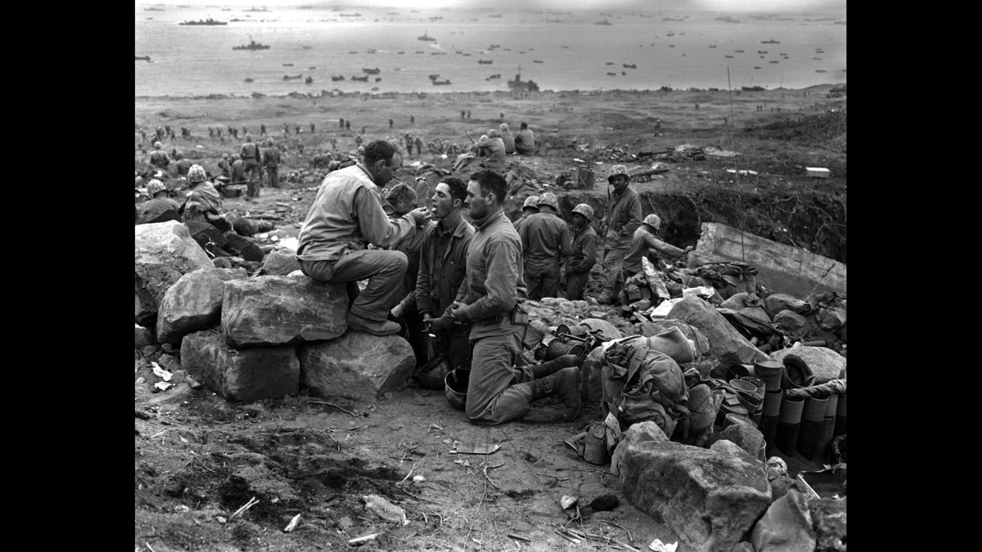 Marines receive communion from a Marine chaplain on March 3, 1945.