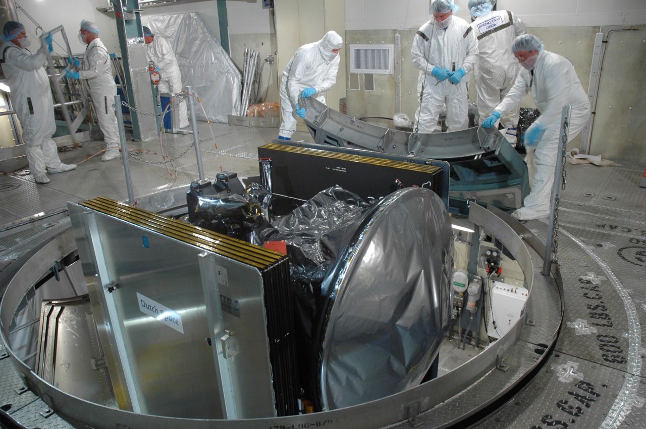 Workers at Cape Canaveral prepare Dawn for launch by removing its transportation canister. Dawn was then mated with a Delta II rocket.