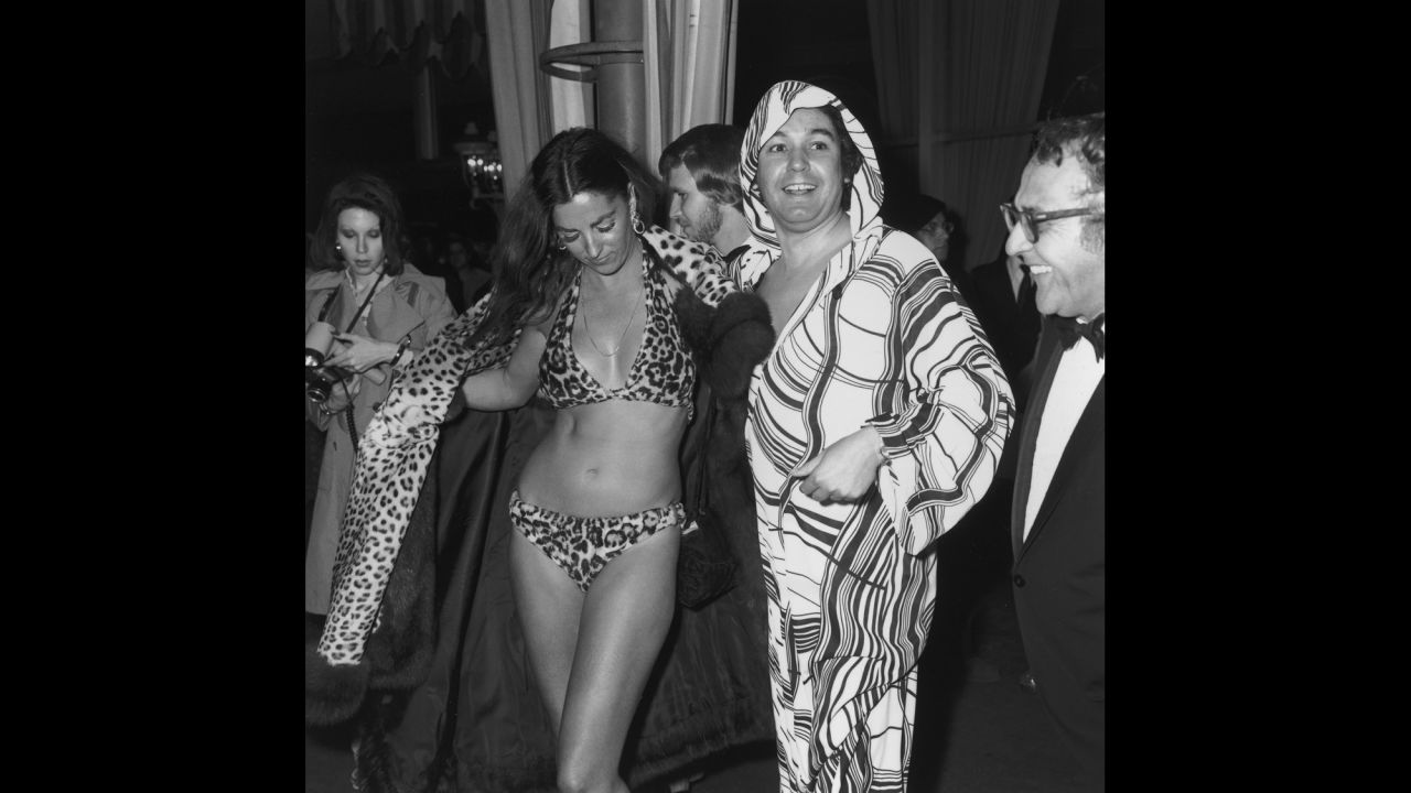 Edy Williams opens her leopard fur coat to reveal a leopard fur bikini at the Academy Awards at the L.A. County Music Center in 1974.