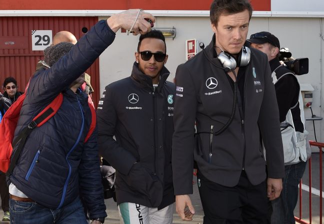 World champion Lewis Hamilton was the subject of close media scrutiny as he arrived for afternoon testing in Barcelona.  Hamilton had to cut short his track time Thursday because he was feeling unwell but impressed in his Friday runs.