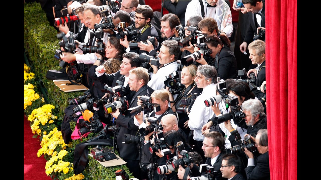 Photographers wait at the edge of the red carpet at the Kodak Theater in February 2009.