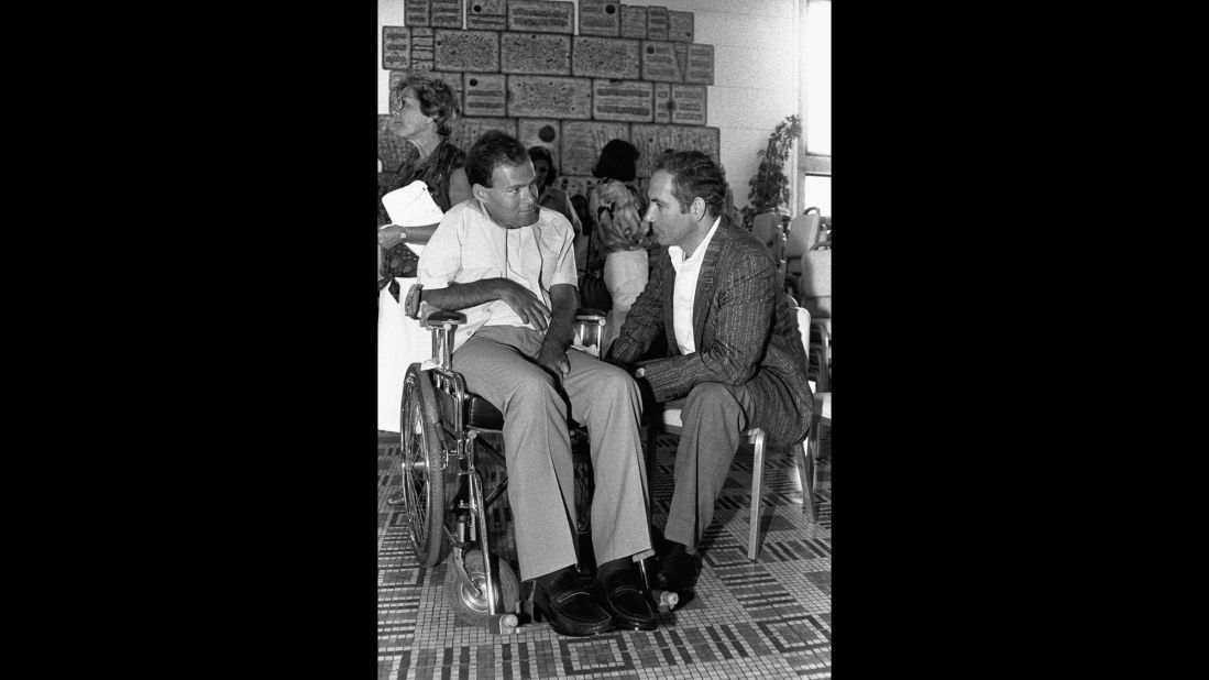 Netanyahu speaks in July 1986 with Sorin Hershko, one of the Israeli soldiers wounded in Operation Entebbe. It was the 10th anniversary of Operation Entebbe, a dramatic rescue of Jewish hostages at Uganda's Entebbe Airport.  Netanyahu's brother, Yonatan, was killed leading Operation Entebbe in 1976. Affected by his brother's death, Netanyahu organized two international conferences on ways to combat terrorism, one in 1979 and another in 1984.