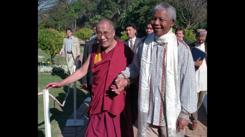 In 1996, the Dalai Lama meets with <a href="index.php?page=&url=https%3A%2F%2Fwww.cnn.com%2F2013%2F03%2F28%2Fafrica%2Fgallery%2Fnelson-mandela%2Findex.html" target="_blank">Nelson Mandela</a>, the prisoner-turned president who reconciled South Africa after the end of apartheid.