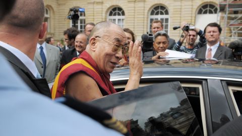 The Dalai Lama leaves the French senate in Paris after a meeting with lawmakers at the height of the Beijing Olympics in 2008. Tibet-related protests disrupted several stages of the worldwide Olympic torch relay in the run-up to the Games.