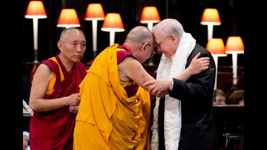 The Dalai Lama embraces John Templeton after receiving the Templeton Prize during a ceremony at St. Paul's Cathedral in London on May 14, 2012. The award honors "outstanding individuals who have devoted their talents to expanding our vision of human purpose and ultimate reality."