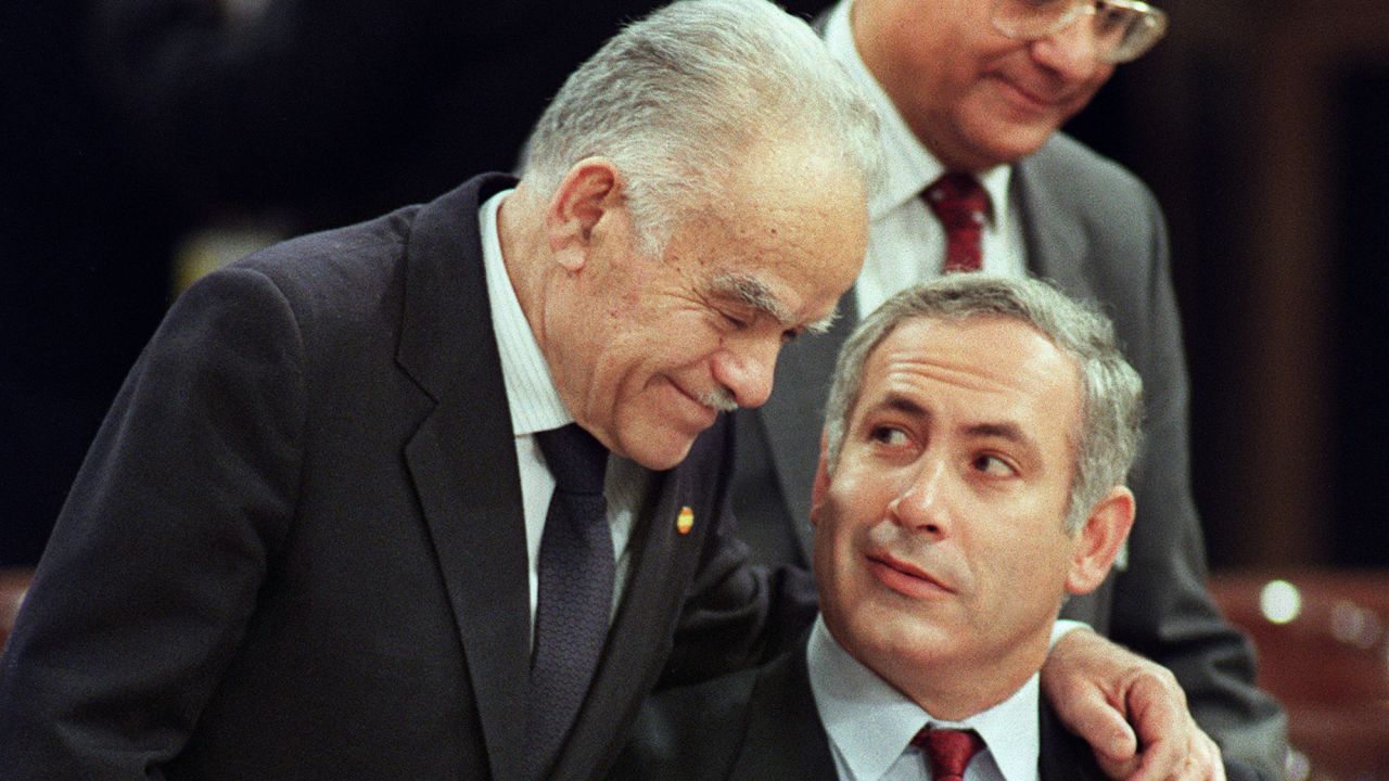 Shamir speaks with Netanyahu at a Middle East peace conference in Madrid in 1991.