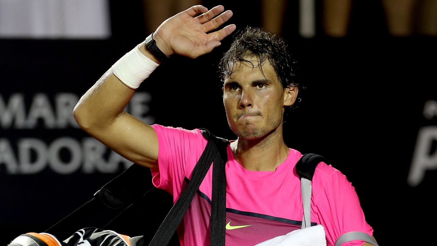 A weary Rafael Nadal waves goodbye to the crowd after his semifinal defeat in Rio to Fabio Fognini.
