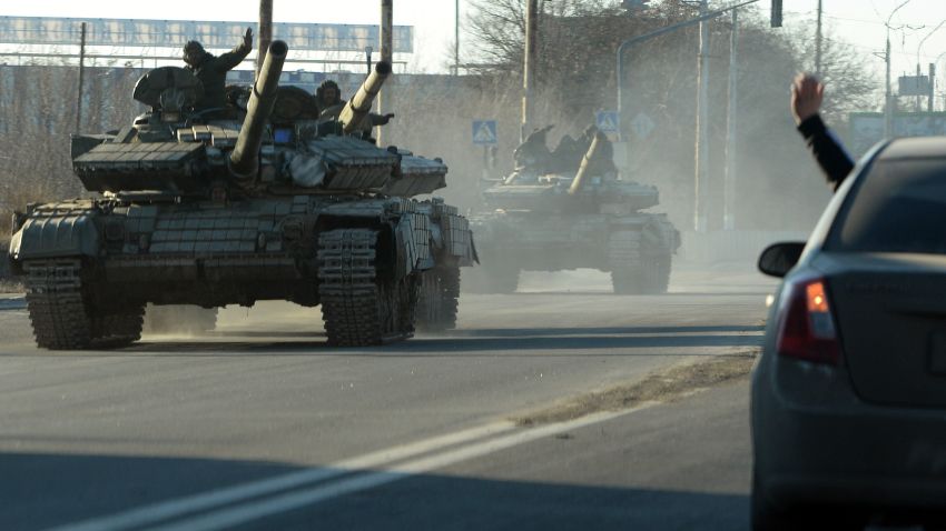 Pro-Russian separatists ride tanks in the eastern Ukrainian city of Lugansk on February 21, 2015. Ukraine's military and pro-Moscow rebels swapped scores of prisoners in rare compliance with a truce so badly breached over the past week that the US warned it could escalate sanctions on Russia within days