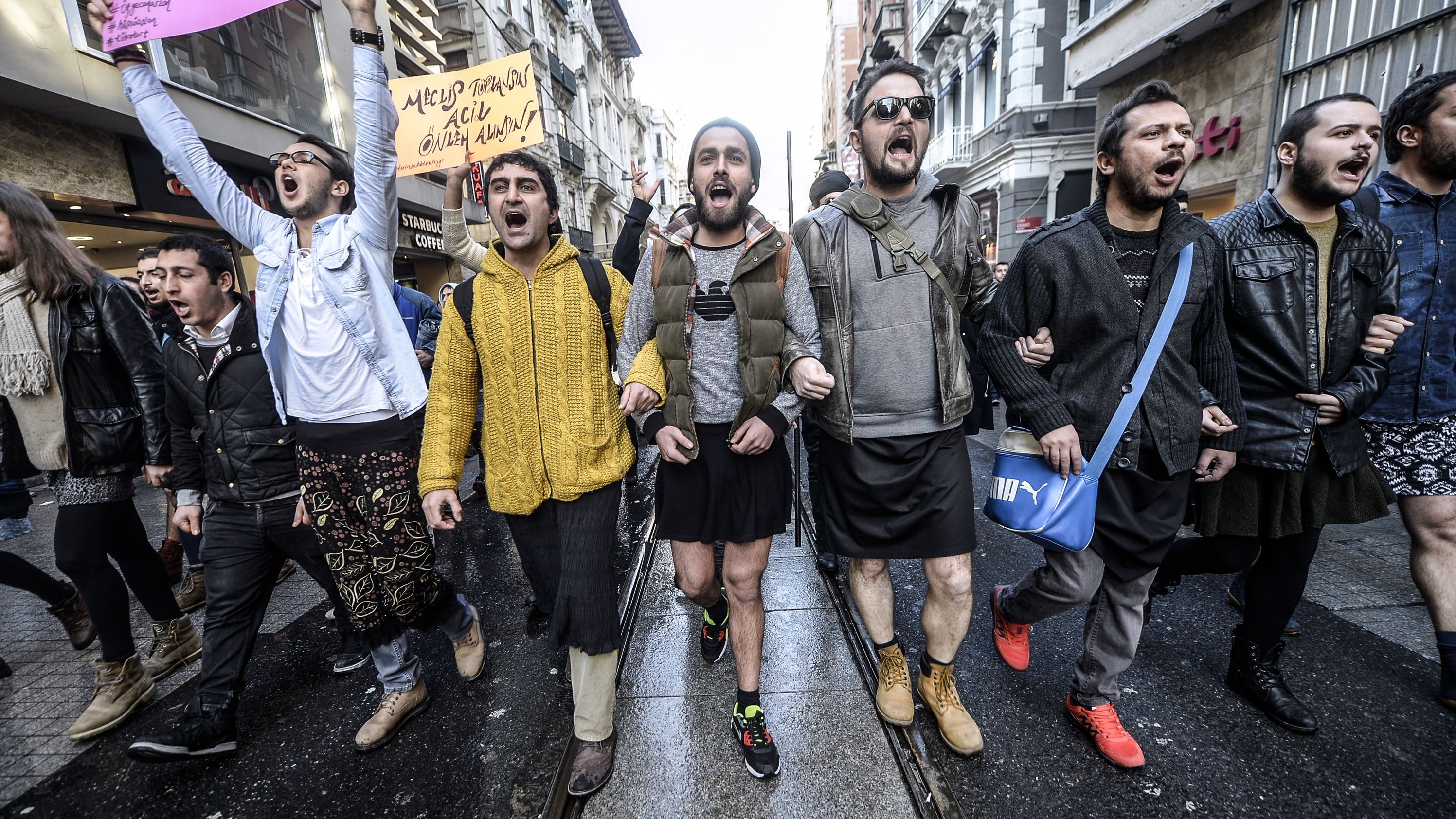 Turkish men wearing skirts demonstrate in Istanbul to support women's rights in memory of 20-year-old murdered woman Ozgecan Aslan on February 21, 2015.
