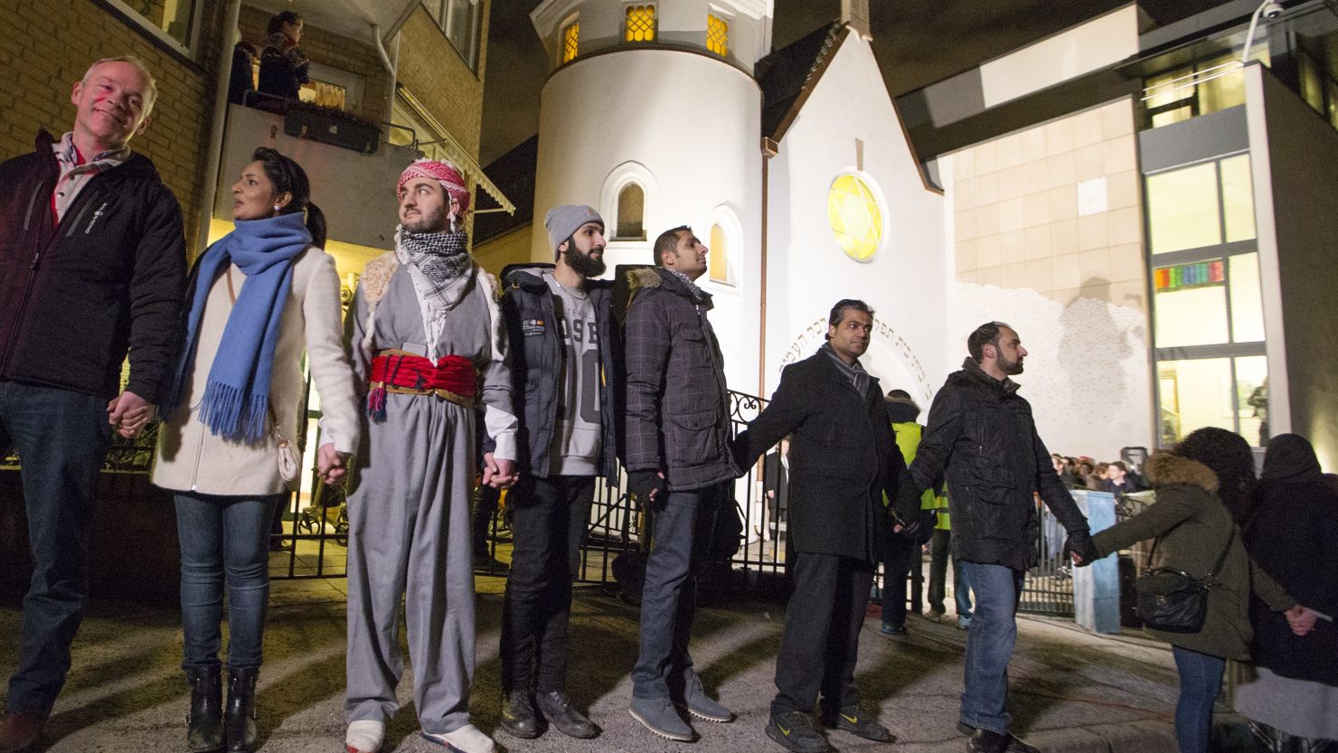 More than 1,000 people formed a "ring of peace" around the Norwegian capital's synagogue, an initiative taken by young Muslims in Norway after a series of attacks against Jews in Europe, in Oslo, Saturday, Feb. 21 2015.