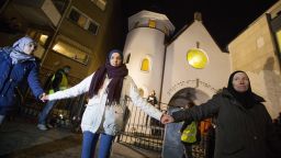 More than 1,000 people formed a "ring of peace" around the Norwegian capital's synagogue, an initiative taken by young Muslims in Norway after a series of attacks against Jews in Europe, in Oslo, Saturday, Feb. 21 2015.