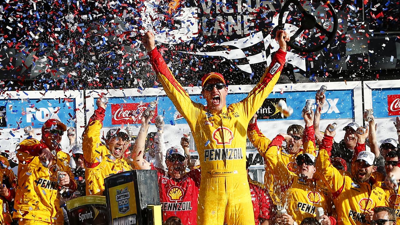 Joey Logano, driver of the #22 Shell Pennzoil Ford, celebrates in victory lane after winning the NASCAR Sprint Cup Series 57th Annual Daytona 500 at Daytona International Speedway on February 22.