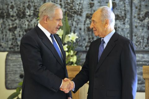 Netanyahu shakes hands with Israeli President Shimon Peres in February 2009 after Netanyahu won backing from the Israeli parliament to become Prime Minister again. A close election between Netanyahu and rival Tzipi Livni had left the results unclear until the parliament's decision. 