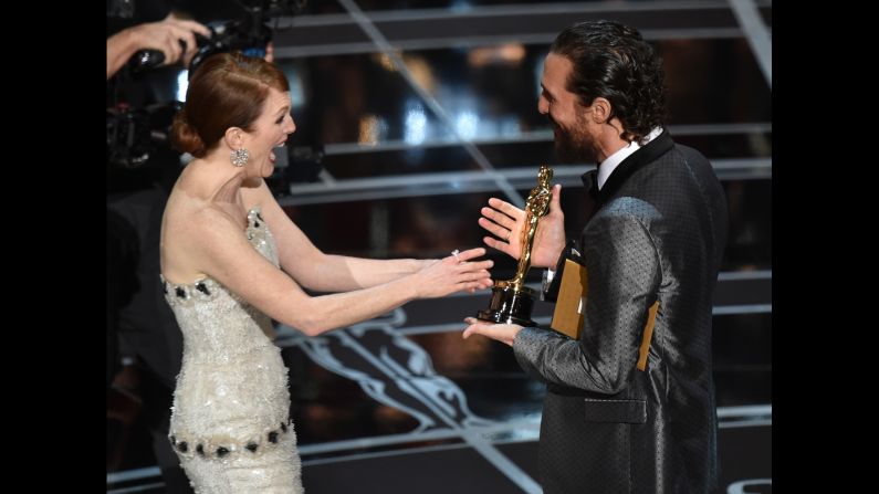 <strong>Julianne Moore (2015):</strong> Matthew McConaughey presents Julianne Moore with the Oscar at the 87th Academy Awards. She won for her role in "Still Alice."