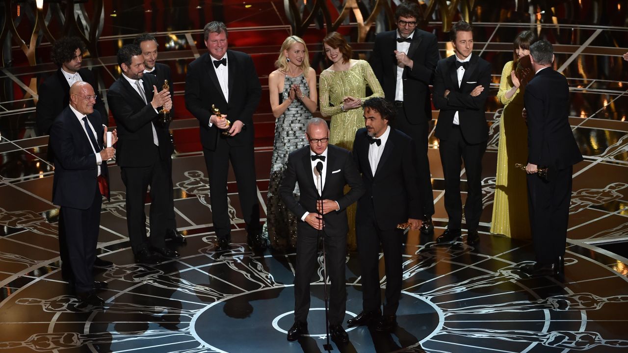 Michael Keaton, front left, and "Birdman" director Alejandro Gonzalez Iñarritu accept the Academy Award for best picture along with other members of the film's cast and crew. "Birdman" also won three other Oscars: best director, best cinematography and best original screenplay.