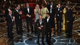 Michael Keaton and director Alejandro Gonzalez Inarritu accept the award for best picture along with other members of the cast and crew of "Birdman." The film also won three other honors: directing, cinematography and original screenplay.