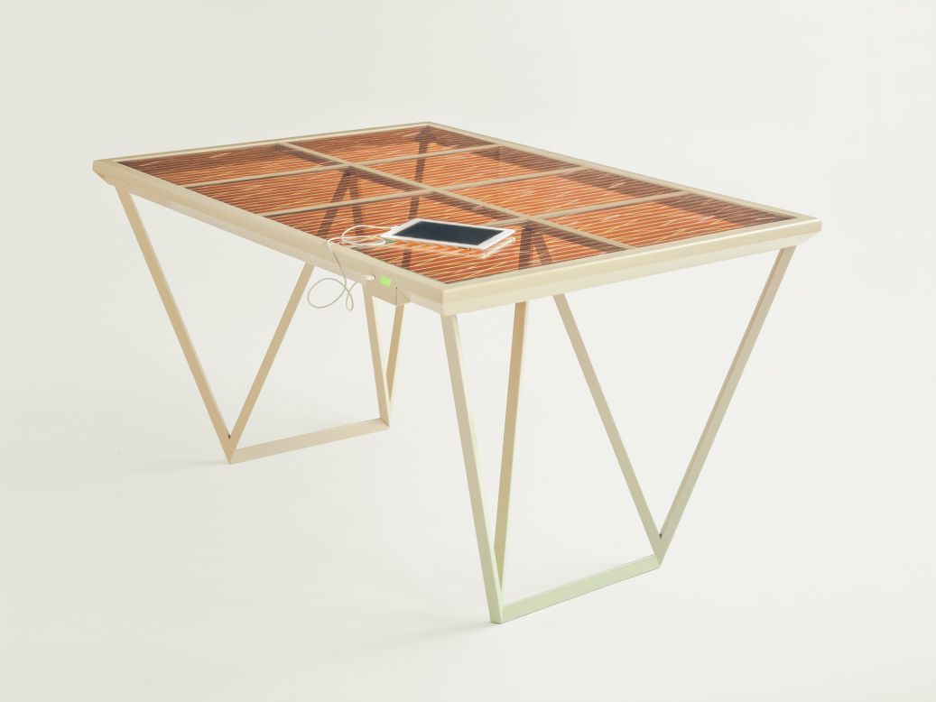 Designed by Marjan Van Aubel in collaboration with Solaronix, the <a href="http://www.marjanvanaubel.com/work/current-table/" target="_blank" target="_blank">Current Table</a> harvests daylight to charge electronic devices, using a Dye Sensitive Solar Cell that, unlike conventional solar panels, doesn't need direct sunlight to generate electricity.
