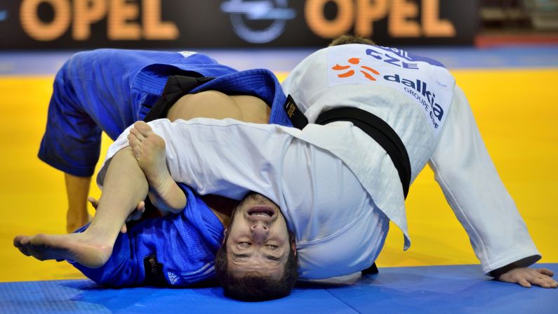 Karil Musil, a judoka from the Czech Republic, holds down Jorge Fernandez of Portugal during the Dusseldorf Grand Prix, a judo tournament in Dusseldorf, Germany, on Saturday, February 21.