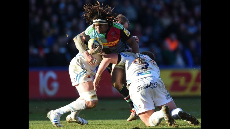 Marland Yarde of the English rugby club Harlequins is tackled Saturday, February 21, during a Premiership match against Exeter Chiefs in London.