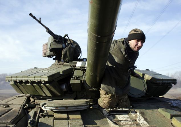 A Ukrainian serviceman climbs out of a Ukrainian army tank at a checkpoint near Horlivka, in the region of Donetsk, on February 23, 2015. 