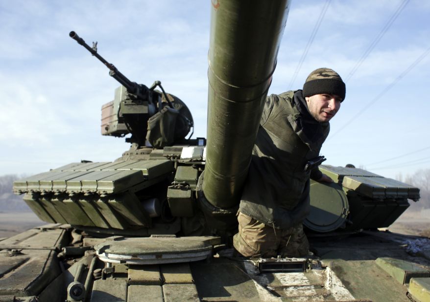 A Ukrainian serviceman climbs out of a tank at a checkpoint near Horlivka, Ukraine, on Monday, February 23.