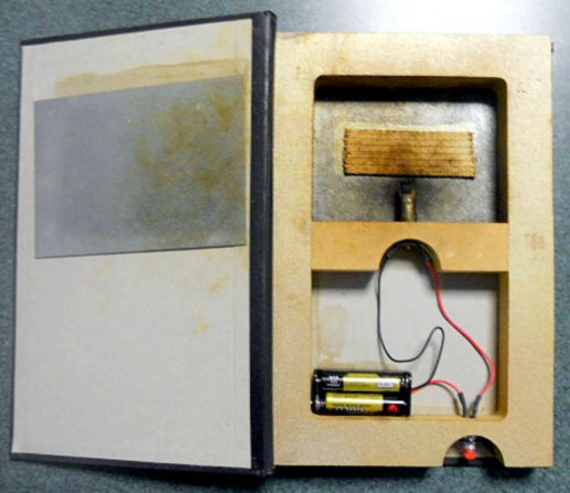 This "burning book" is a gag from a magic store. The safety of traveling with such an item is questionable in the best of times, says the TSA. Even if the item weren't flammable, it bears an eery resemblance to an improvised explosive device.
