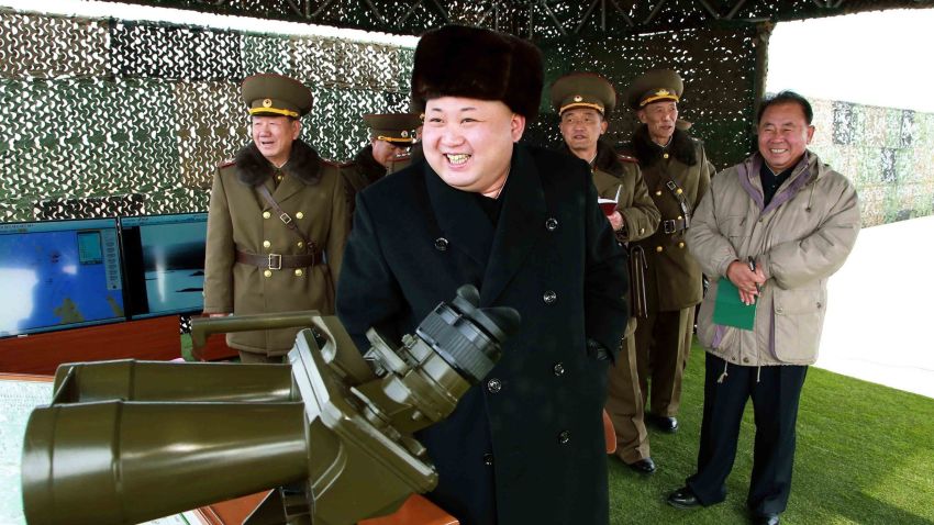 This undated picture released from North Korea's official Korean Central News Agency (KCNA) on February 21, 2015 shows North Korean leader Kim Jong-Un (C) inspecting a drill for striking and seizing island at an undisclosed location in North Korea.