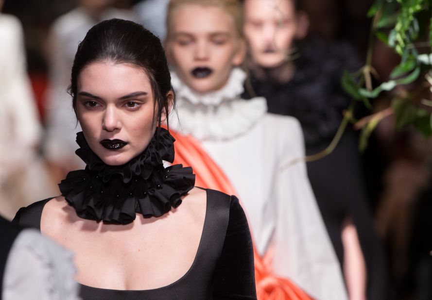 Kendall Jenner, kid sister to Kim Kardashian and a rising model, attracted her share of photos as she took to the runway at Giles. (Fellow model and BFF Cara Delevingne was in the audience to show her support.)