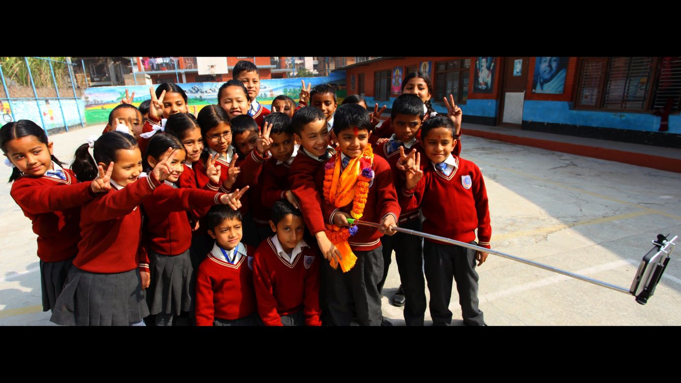 Saugat Bista takes a selfie with his classmates in Kathmandu, Nepal, on Sunday, February 22, after breaking the Guinness World Record for world's youngest director. Bista directed the feature film "Love You Baba" at the age of 7 years, 340 days.
