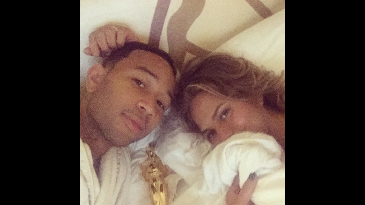 "Bed time," said singer John Legend in this selfie <a href="https://instagram.com/p/zcEfTgESuo/?modal=true" target="_blank" target="_blank">he posted</a> of him and his wife, model Chrissy Teigen, on Monday, February 23. Oh yeah, and that's an Oscar next to them. He and Common won the Academy Award for best original song ("Glory").