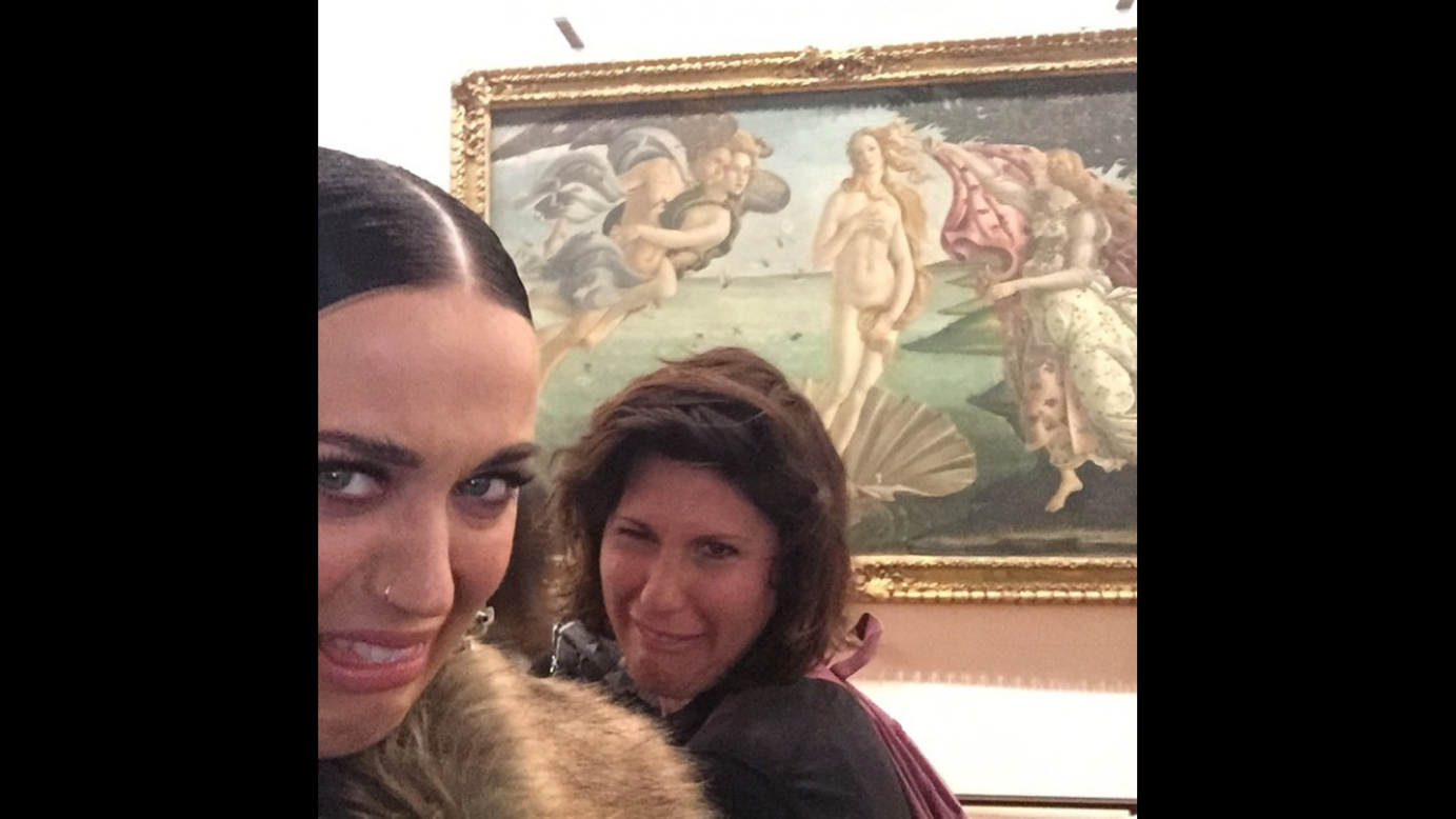 Singer Katy Perry, left, doesn't appear to be a fan of the Botticelli painting "The Birth of Venus," <a href="https://instagram.com/p/zWOdbeP-fS/?modal=true" target="_blank" target="_blank">which she saw</a> Friday, February 20, in Florence, Italy. 