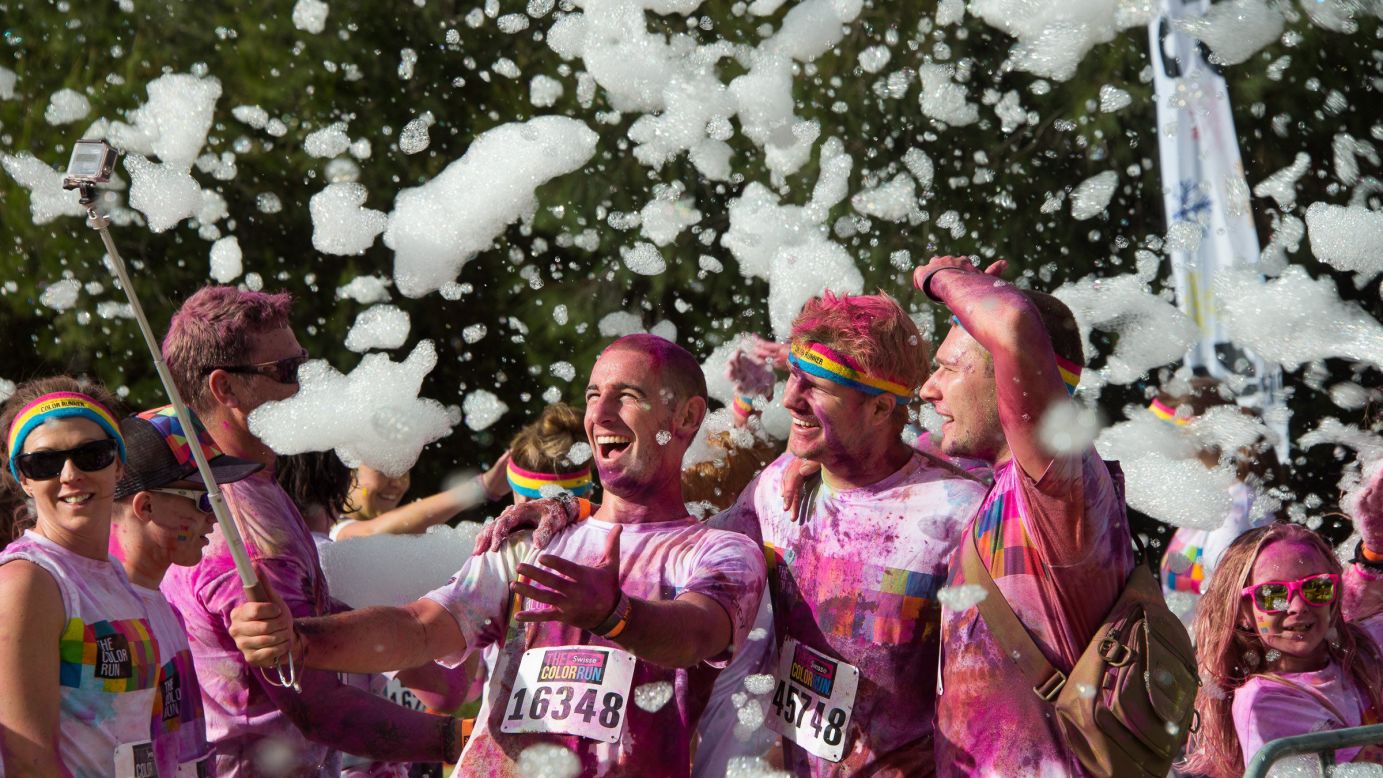 People take a selfie while participating in the Color Run event in Canberra, Australia, on Sunday, February 22.