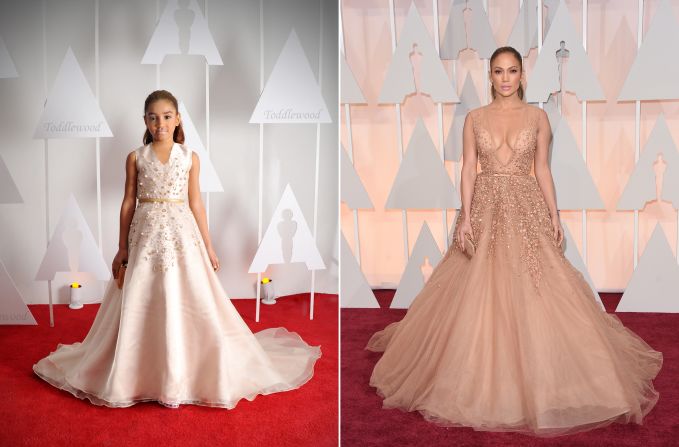 In order to stun like Jenny from the Block, designer Andrea Pitter glued hundreds of pearls and gems onto a mini version of gown worn by Jennifer Lopez. She raised the neckline considerably, however, to make it more kid-friendly.