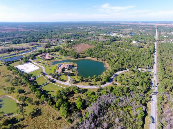 The approximately 50-acre property has riding trails running across the grounds -- ride around the four-acre lake stocked with bass or go further afield and explore the nearby 20,000-acre national preserves.