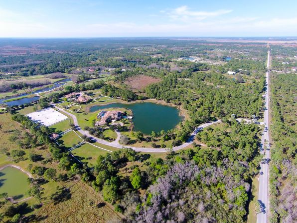 The approximately 50-acre property has riding trails running across the grounds -- ride around the four-acre lake stocked with bass or go further afield and explore the nearby 20,000-acre national preserves.