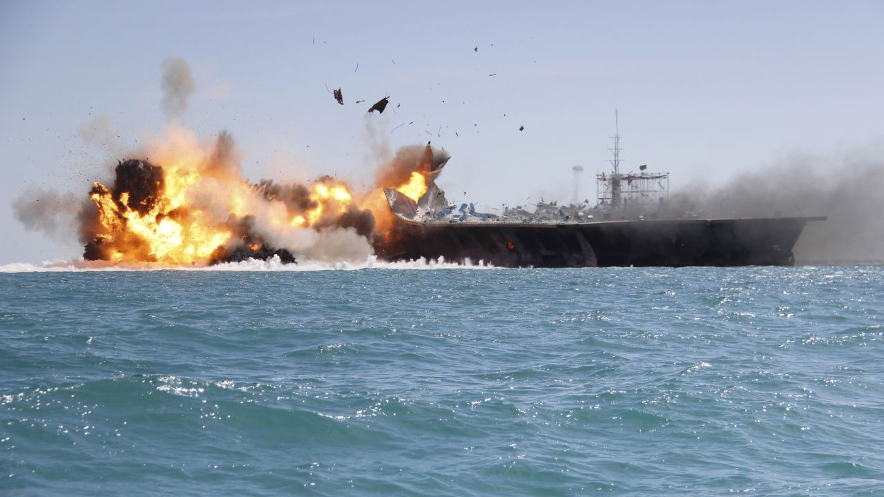 The mock U.S. aircraft carrier explodes during the large-scale naval drills near the entrance of the Persian Gulf. The drill, named Great Prophet 9, was the first to involve a replica of a U.S. carrier.
