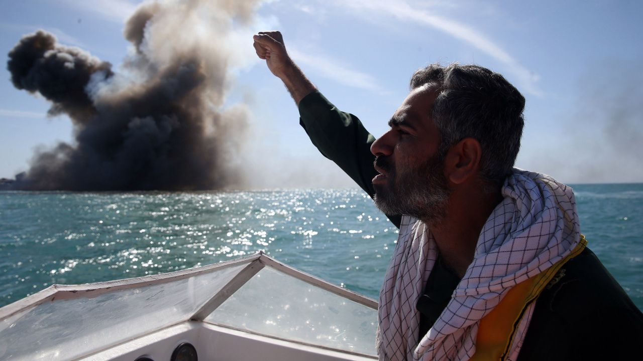A member of the Revolutionary Guards chants slogans after attacking the vessel.