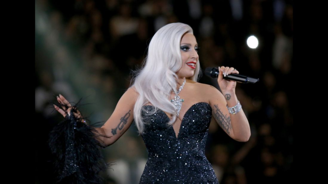 Lady Gaga draws attention to her unusually ample cleavage as she steps out  in just a bra
