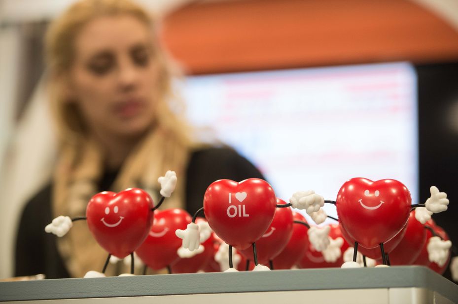 A woman works at a stand promoting the oil industry.