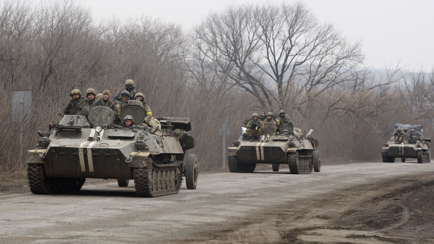 Ukrainian armored personnel carriers move cannons from their position near the eastern Ukrainian city of Artemivsk, in the Donetsk region on February 26, 2015. 